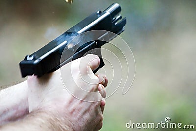 Pistol in Action Stock Photo