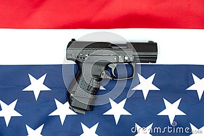 Pistol, american flag flat lay on gray background. United States Gun Laws - Guns and weapons Stock Photo