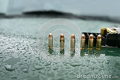 Pistol Ammo On Hood Stock Photo