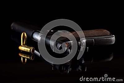 Pistol 1911 with ammunition on black Stock Photo