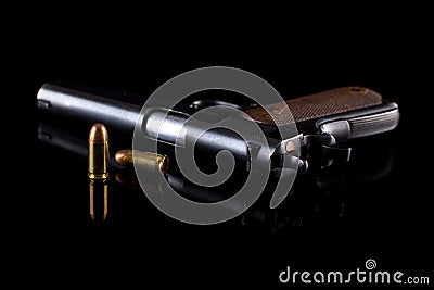 Pistol 1911 with ammunition on black Stock Photo