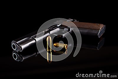 Pistol 1911 with ammunition on black Stock Photo