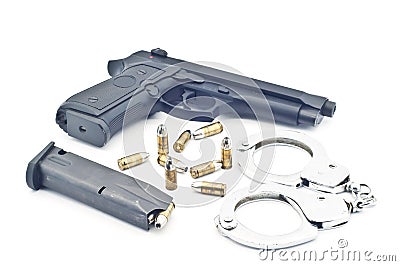 Pistol bullet magazine and handcuff . Stock Photo