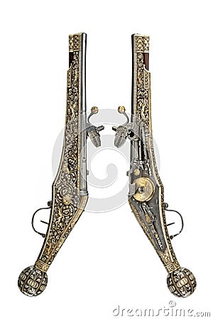 Pistols pair original antique wheelock and flint pistols Stock Photo