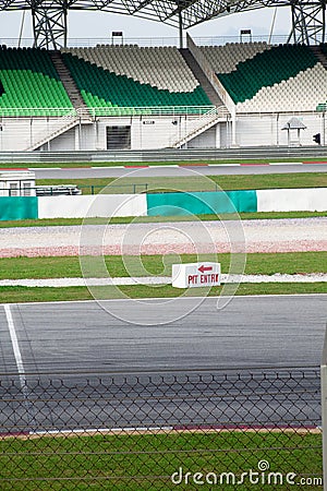 Pit stop, spectator grandstand and meshed fence Stock Photo