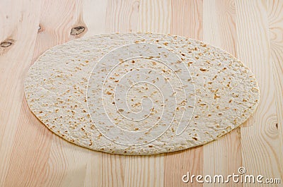 Pita bread on kitchen wooden plank Stock Photo