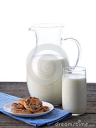 Pitcher and glass with some milk and cookies Stock Photo