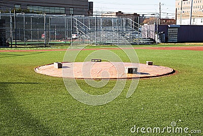 Pitchers mound covered with a tarp Stock Photo