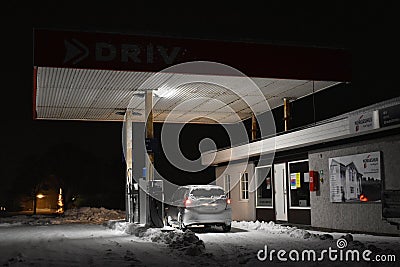Pitstop in a snow-covered gas station Stock Photo