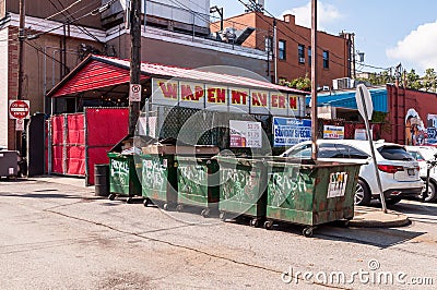 Pittsburgh, Pennsylvania, USA 8/23/20 Garbage dumpsters lined up in a parking lot behind a restaurant Editorial Stock Photo
