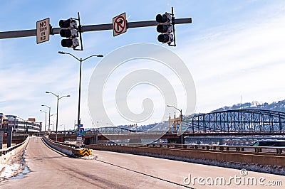 Pittsburgh, Pennsylvania, USA 2-21-21 Traffic lights above the on ramp to State Route 376 east at Fort Pitt Boulevard with the Smi Editorial Stock Photo