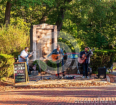 Pittsburgh, Pennsylvania, USA 8/24/2019 A trio band performing at the `Race Around the Square` in the Regent Square neighborhood Editorial Stock Photo