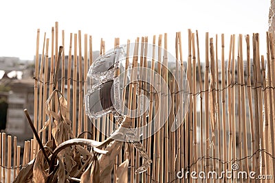 Pixel model sunglasses hanging on a babmboo decoration. Selective focus Stock Photo