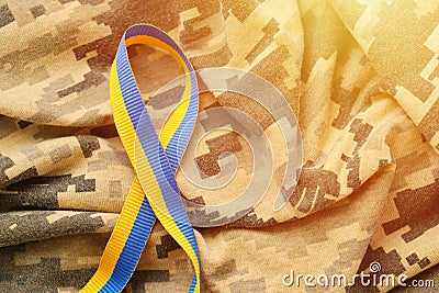 Pixeled digital military camouflage fabric with ribbon Stock Photo