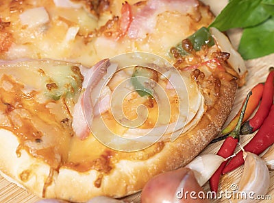 Pizza background in fast food close up with fresh paprika, garlic, shallots Stock Photo