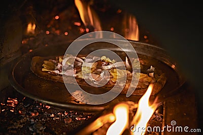 Pizza in a bread wood fired oven Stock Photo