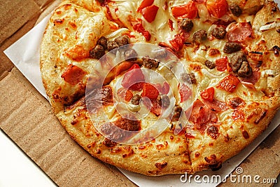 Pizza, close up photo of a delicious pizza with mozzarella cheese, onions, meat, tomato Stock Photo