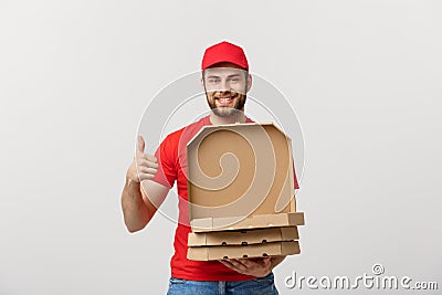 Pizza delivery concept. Young boy is delivering and showing pizza boxs in boxes. Isolated on white background Stock Photo