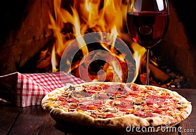 Pizza and glass of wine Stock Photo