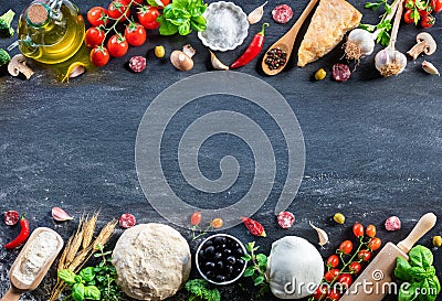 Pizza Ingredients On Black Table In A Raw Stock Photo