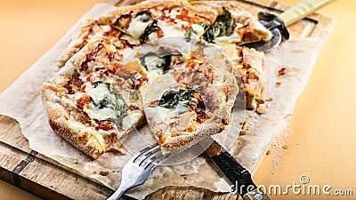 Pizza Margherita with basil on a cutting board. Close-up. Horizontal shot. Orange background Stock Photo