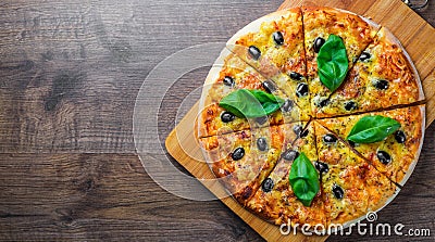 Pizza with Mozzarella cheese, Tomatoes, pepper, olive, Spices and Fresh Basil. Italian pizza. Pizza Margherita or Margarita on woo Stock Photo