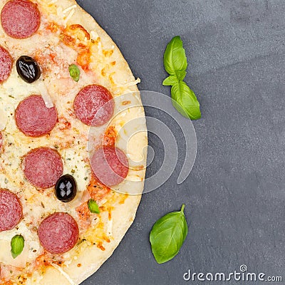 Pizza pepperoni salami from above copyspace copy space square close up on a slate Stock Photo