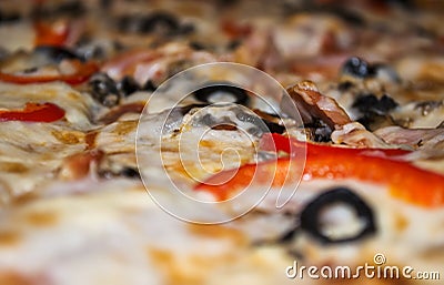 Pizza with peppers, olives, ham and cheese Stock Photo