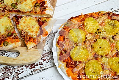 Pizza with potatoes and bacon and pizza with cheese Stock Photo