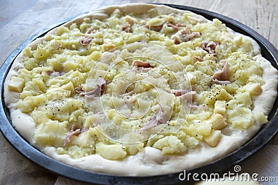 Pizza with potatoes and ooked ham Stock Photo