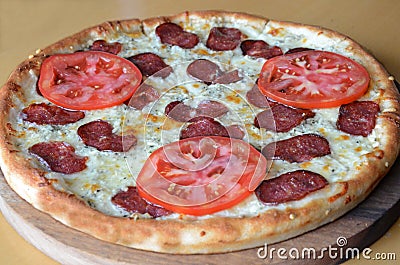 pizza with salami and tomato Stock Photo