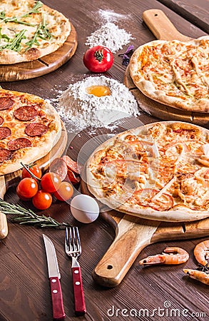 pizza with seafood and cheese, four cheeses, pepperoni, meat, margarita Stock Photo