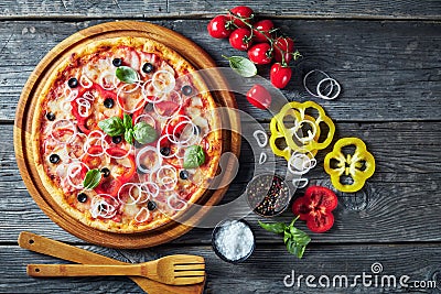 Pizza with tomatoes, cheese, onions, ham, olives Stock Photo