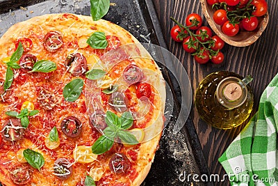 Pizza with tomatoes, mozzarella and basil Stock Photo