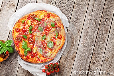 Pizza with tomatoes, mozzarella and basil Stock Photo