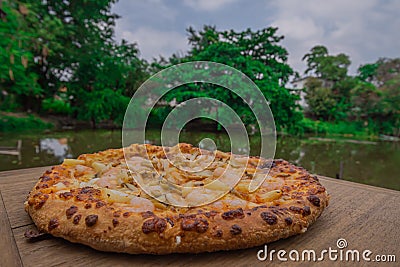 Pizza on wood. Shrimp Pizza. Pizza background image placed on a wooden floor Stock Photo