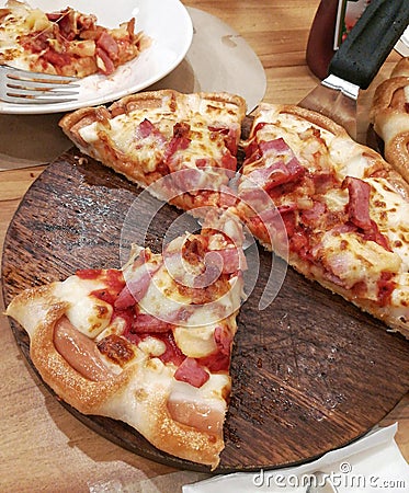 Pizza on the wooden tray. Stock Photo