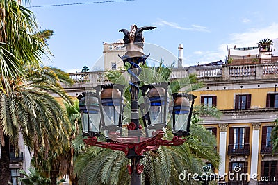 Placa Reial, detail of colorful lamp post known as GaudÃ¬ first opera. Barcelona Editorial Stock Photo