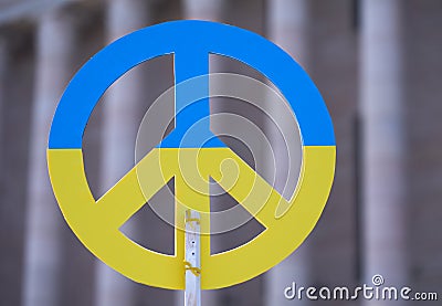 Placard with a blue and yellow Ukrainian flag colour peace sign Editorial Stock Photo