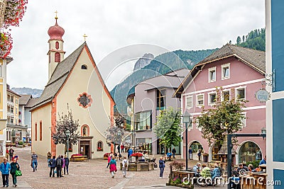 Place with Church of Saint Antonius in Ortisei - Italy Editorial Stock Photo