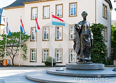 The Place Clairefontaine with flags of Luxembourg and statue of Grand Duchess Charlotte of Luxembourg Editorial Stock Photo