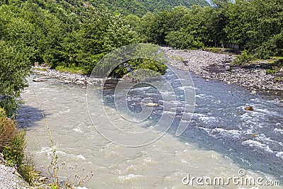 Place of confluence of `black` and `white` Aragvi, where the water in the river does not mix Stock Photo