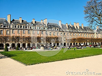 Place des Vosges in Paris in the spring sunny day Editorial Stock Photo