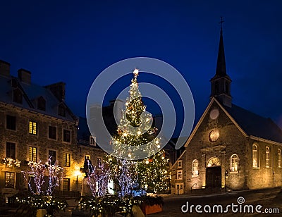 Place Royale Royal Plaza and Notre Dame des Victories Church decorated for Christmas at night - Quebec City, Canada Stock Photo