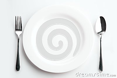 Place setting with plate, spoon and fork Stock Photo