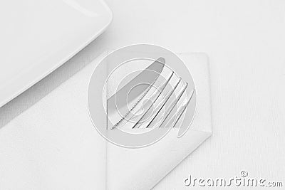 Place setting, white plate with cutlery Stock Photo