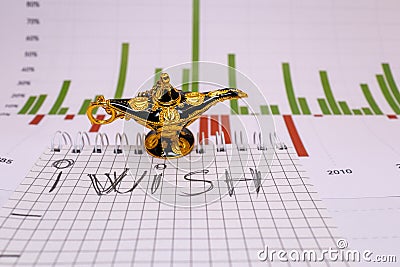 place for text, notebook, graph with pen and euro coins. Close-up of a pen and euro coins on top of a financial graph Stock Photo