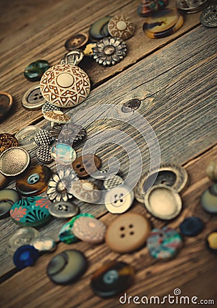 Placer of vintage buttons on aged boards Stock Photo