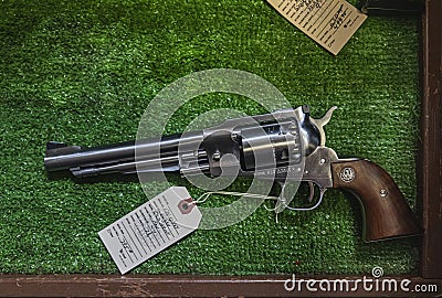 Contemporary reproduction of a vintage black powder cap and ball Ruger Old Army revolver at a gun shop Editorial Stock Photo