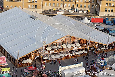 Plaerrer, Augsburg Germany, APRIL 22, 2019: view out of the ferris wheel over the Augsburger Plaerrer. View over a big beer tent Editorial Stock Photo